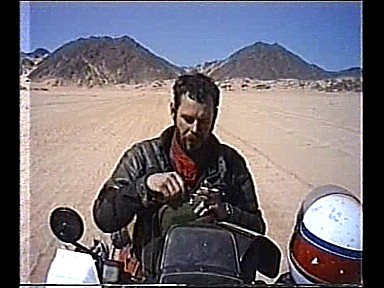1986-South Algeria-desert-Jochen-short rest-important to drink water_out of my movie at YouTube-click above_Jochen A. H�bener