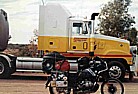 Australia, Northern Territories_my motorcycle BMW R100GS seems like a fly, in front of a so called 'road-train'_my trip 'around the world' by motorcycle 1995-96_Jochen A. H�bener